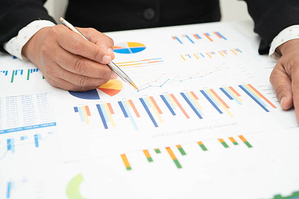 istock Asian business woman working with financial graph. 2239281688