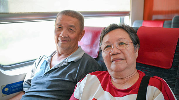 istock Journey Together: Mature Couple on Train Adventure 2239285221