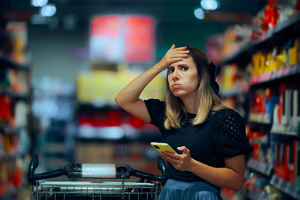 istock Woman Checking Shopping List on her Phone Forgetting Something 2239289687