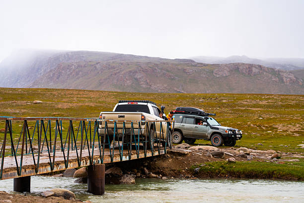 Aerial view of camper van epic Route 1 Golden Circle road  surrounded by rivers and mountains in   Iceland