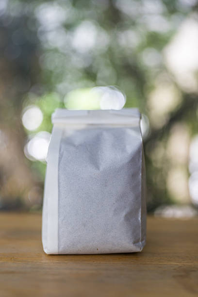 istock White paper coffee bag with ground coffee 2239291175