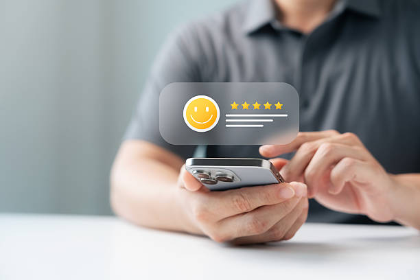 istock Customer satisfaction review and rating concept on smartphone with five star feedback. User giving positive evaluation through digital for online reputation, service quality, business success. 2239291826