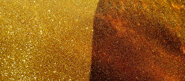 istock Abstract gold sparkles background with sunlight shadow template with copy space. 2239292139