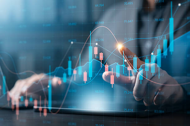 istock Stock market analysis concept with businessman using laptop and tablet touching digital candlestick chart, trading, financial planning, economic forecasting and investment decision making. 2239293908