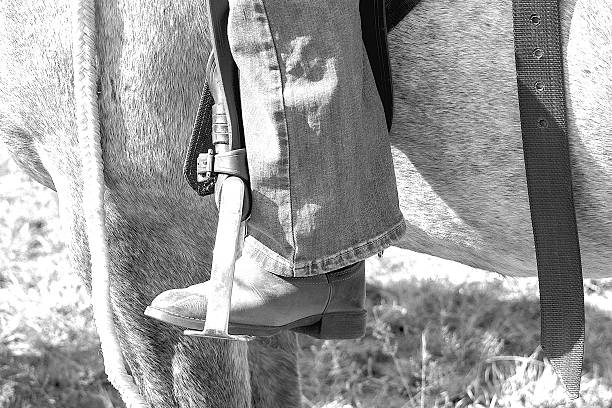 Rancher woman prepares saddle to ride