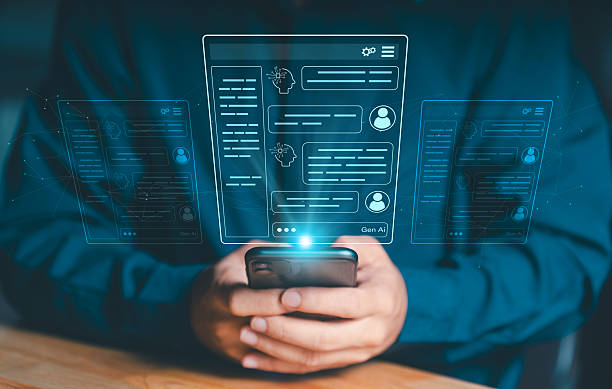 istock Hands holding a smartphone with a futuristic Gen AI or Chatbot interface displayed in holographic form. Concept of artificial intelligence and digital assistance. 2239313443