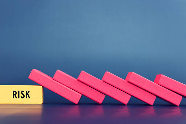 istock stopping the domino effect. executive and risk control concept 2239313472