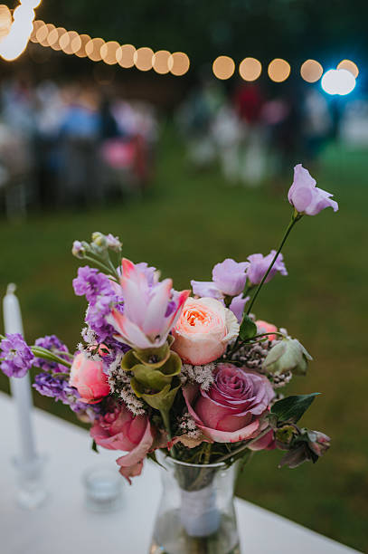 istock Wedding table with fresh flowers decoration. Forest / garden wedding 2239315304