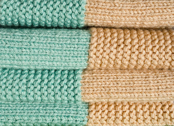 istock A textured, warm, hand-woven throw in apricot and mint. 2239318723