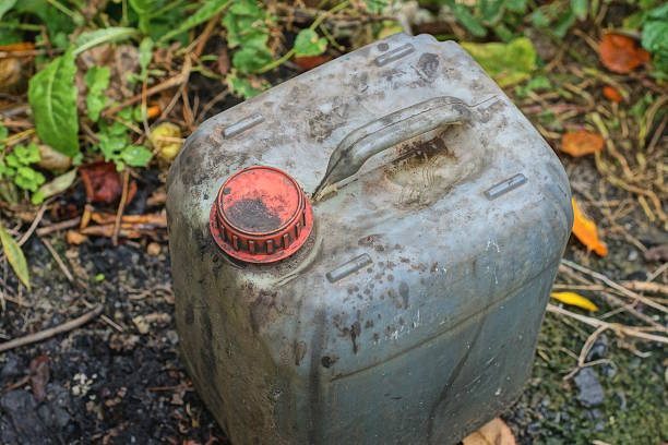 istock One old gray dirty plastic canister with a red cap filled 2239319419