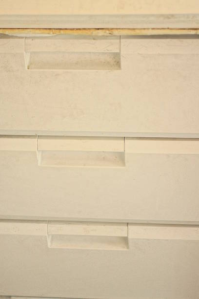 istock White plastic shelves and boxes on the open refrigerator door 2239319464