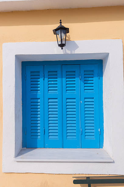 istock Traditional Blue Shutters On Greek Mediterranean Building Facade 2239320877