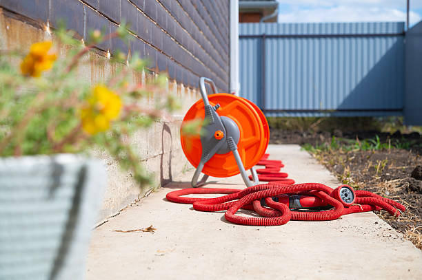 istock Garden watering hose with nozzle for plants and household needs 2239323488