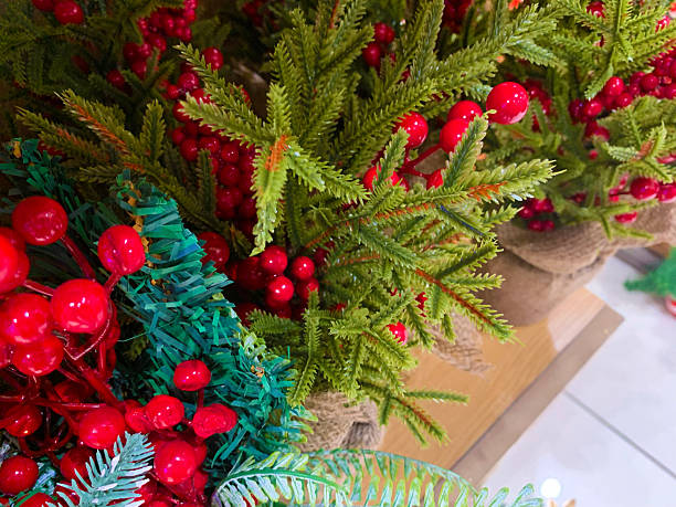 istock Red cherries Christmas ornaments on the tree 2239325454