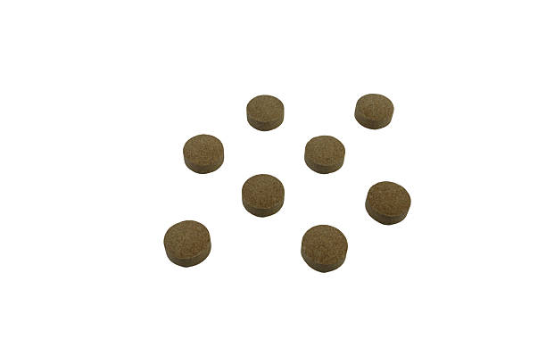 istock Isolated image presenting scattered brown round tablets on transparent backdrop, enhancing graphic 2239325817