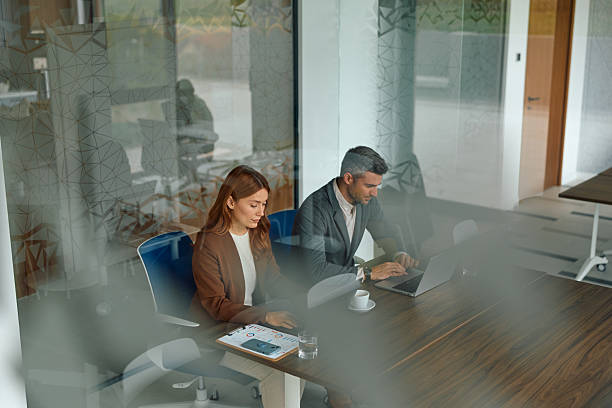 istock Business colleagues collaborating and working together in modern office 2239333787