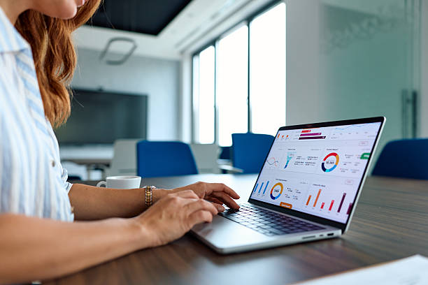 istock Businesswoman hands typing on laptop analyzing business data 2239334006