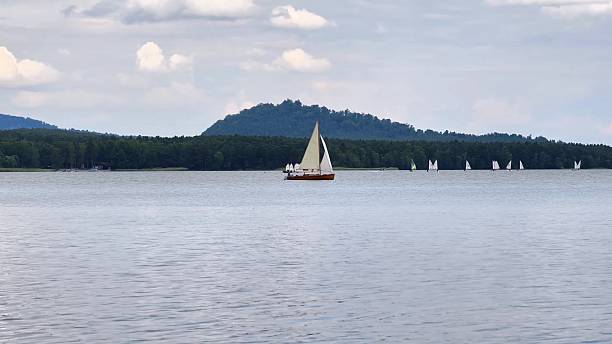 istock Sailing on calm waters, surrounded by a stunning mountain backdrop that enchants the senses 2239336648