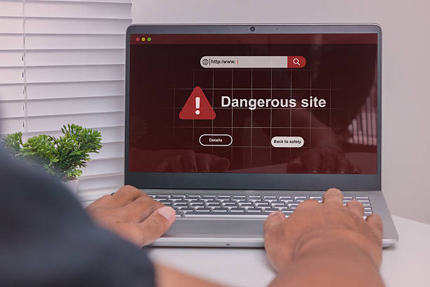 istock Dangerous site warning on laptop computer. A man visit a website indicates malware, phishing or deceptive practices on his laptop. 2239339440