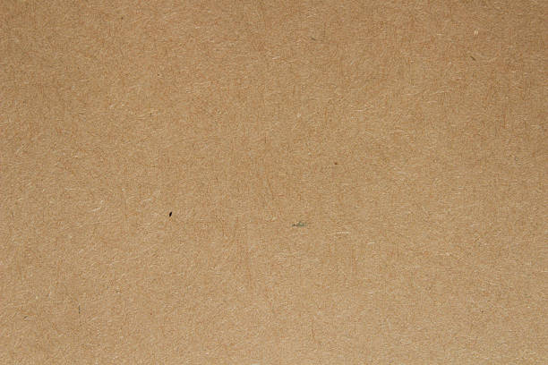 istock Brown kraft paper texture background. Natural recycled cardboard surface with subtle fiber details, perfect for packaging 2239342951