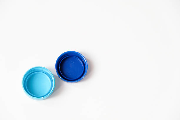 istock Blue water plastic caps for recycling isolated on white background 2239347533