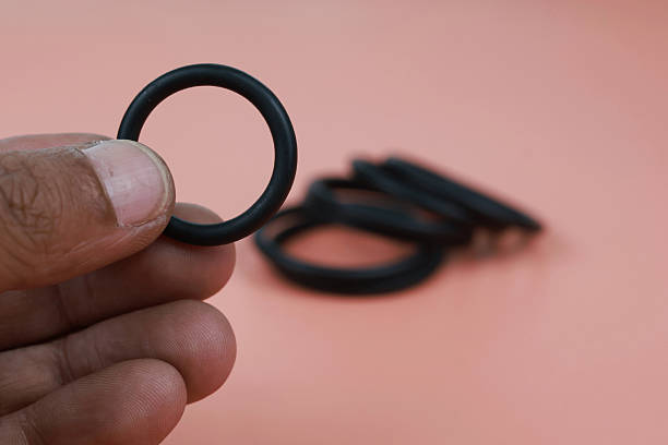 istock Close up O-ring or rubber gasket on finger 2239350536