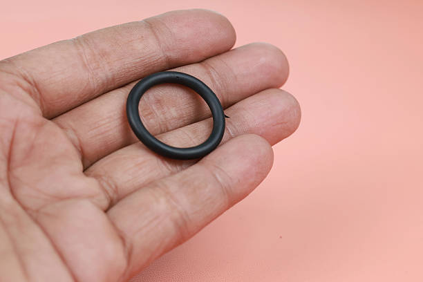 istock Close up O-ring or rubber gasket on finger 2239350788