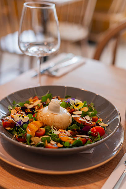 Chef prepares a delicious Italian burrata in the restaurant's kitchen