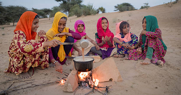 istock Indian children preparing chai - masala tea 2239356230