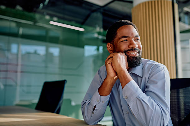 istock Businessman daydreaming about future success in office 2239358153