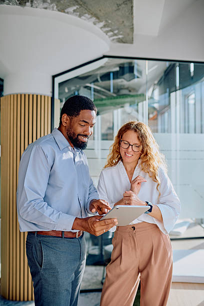 istock Diverse colleagues collaborating on digital tablet in office 2239358314