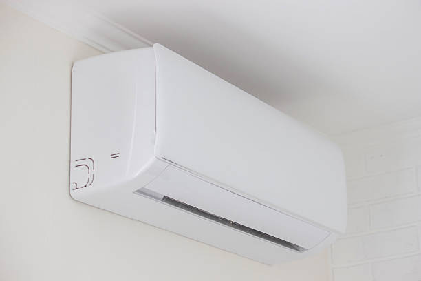 istock Modern White Air Conditioner Unit Mounted on a Wall in a Home or Office 2239358993
