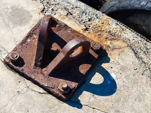 A structure located in ports, such as a pier, dock or breakwater, where the boat or ship's ropes are tied.  Bollard