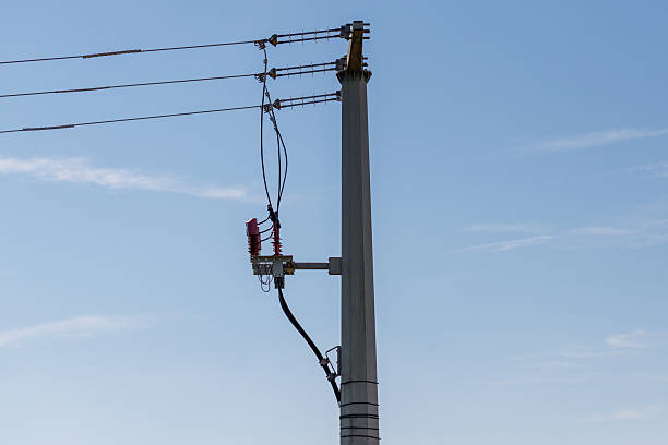 istock Concrete Power Pole with Overhead Wires and Insulator 2239363596