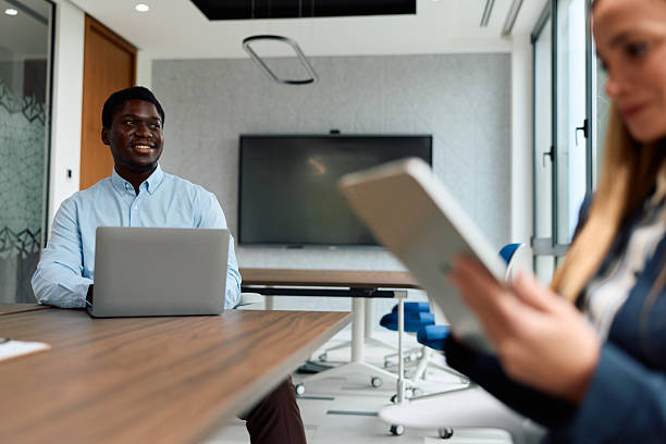 istock Diverse business professionals having informal meeting in modern office 2239372432