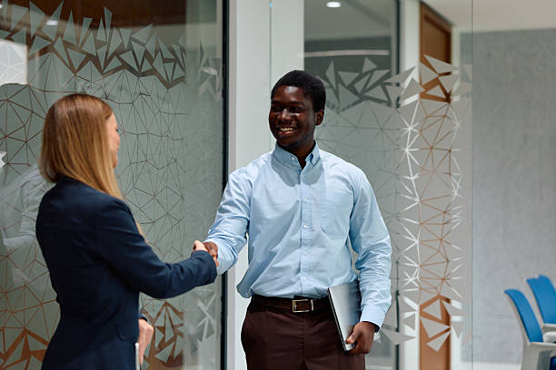 istock Business professionals shaking hands reaching partnership agreement 2239372476