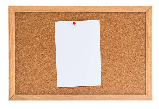 istock Blank paper note pin on cork board isolated on white background 2239372614