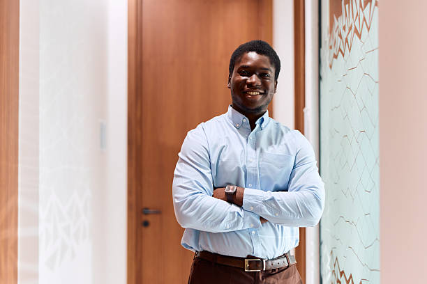 istock African American man smiling with arms crossed 2239372643