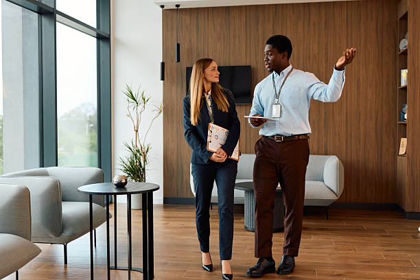 istock Business colleagues walking and discussing in modern office 2239372656