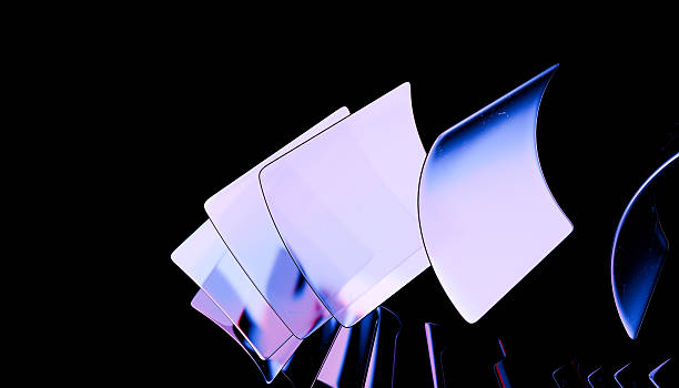 istock Abstract image featuring translucent, curved shapes with gradient of purple and blue hues against black background, creating futuristic and dynamic visual effect 2239379459