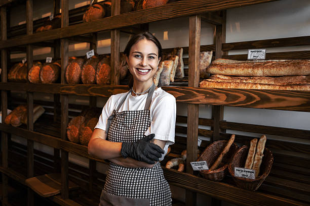 istock Smiling Woman Displaying Pastry 2239381977