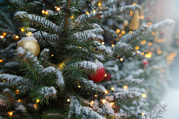 istock Festive pine tree decoration captured with a cozy, bokeh-filled background. 2239394919