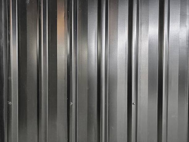 istock Texture of an old metal rolling shutter door. Backgrounds, textures, or design elements related to urban decay, construction, or street photography themes 2239398037