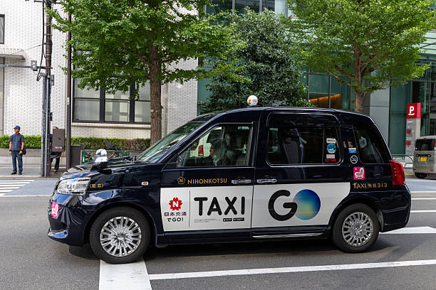 Tokyo, Japan - September 24, 2025 : Ride-hailing company Go App advertisement on a taxi in Tokyo, Japan.