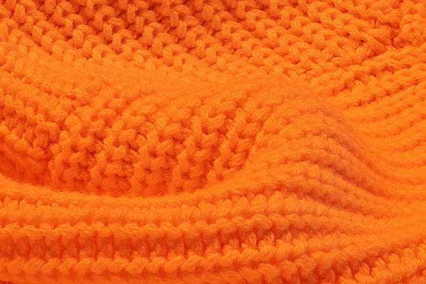 istock A close up of a knitted orange sweater 2239401393