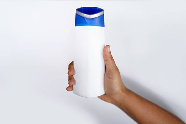 istock Hand holding a shampoo bottle of shampoo 2239402127