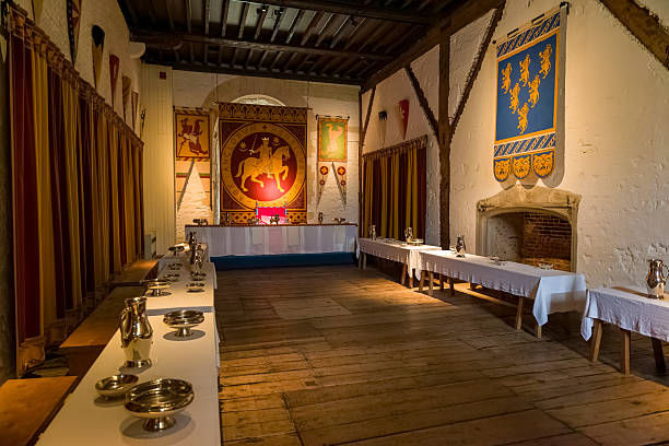 Interior of medieval Great Hall in Dover Castle with banquet tables and banners