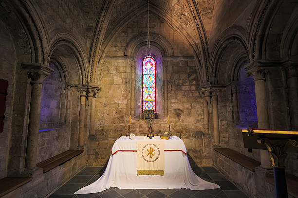 Historic Norman chapel interior inside Dover Castle, England, with stone altar
