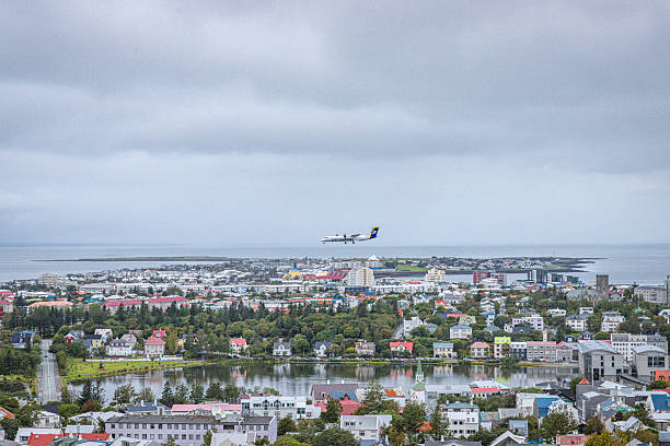 Reykjavik, Iceland. August, 2025. The city center of the nordic capital by the Atlantic Ocean. Aeroplane landing.