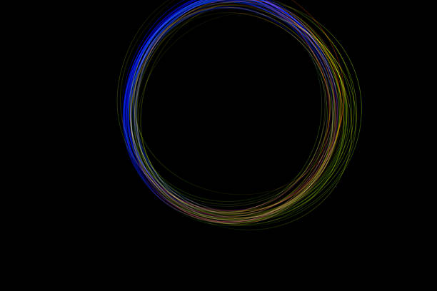 istock A vivid circle of freeze light appears against a dark background, displaying an array of vibrant colors in a smooth round design 2239418650